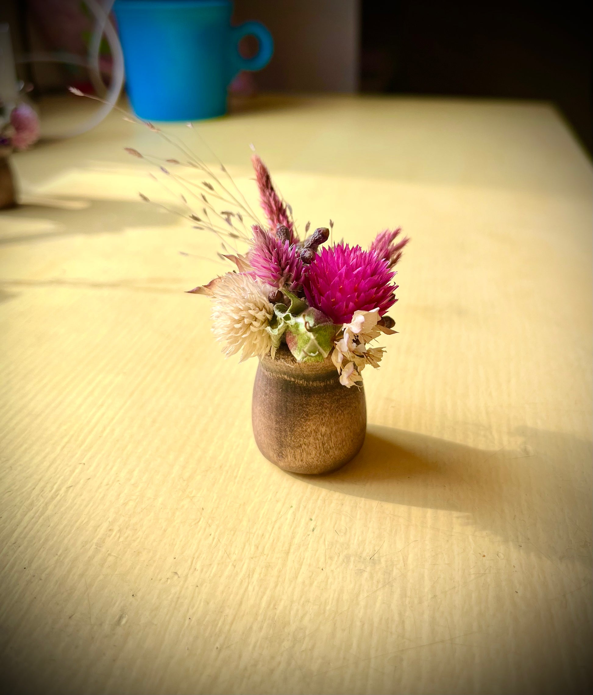 Tiny pink dried flower arrangement
